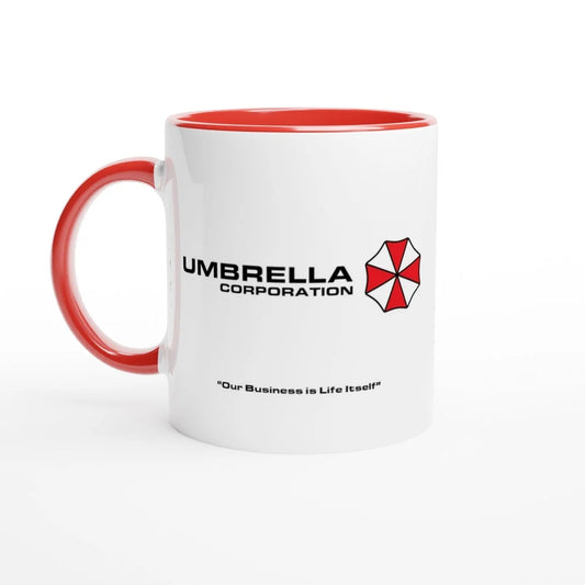 A white mug features a red interior and handle displaying the Umbrella Corporation logo and the phrase "Our Business is Life Itself" referencing Resident Evil.