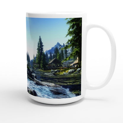 A white ceramic mug displays a scenic landscape from the video game Skyrim, featuring mountains, trees, and a river.