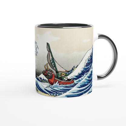 A white mug displays a design combining Hokusai's Great Wave off Kanagawa with Link from The Legend of Zelda: Wind Waker sailing on a boat.