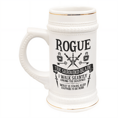 A white ceramic tankard features "ROGUE" in large lettering along with illustrations of potions, daggers, and skulls, referencing a D&D character class.