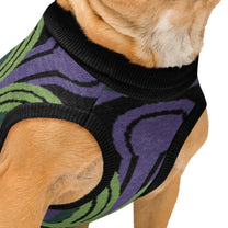Close up details of dog wearing an Overlook Hotel Room 237 Wallpaper pattern knitted jumper on a white background