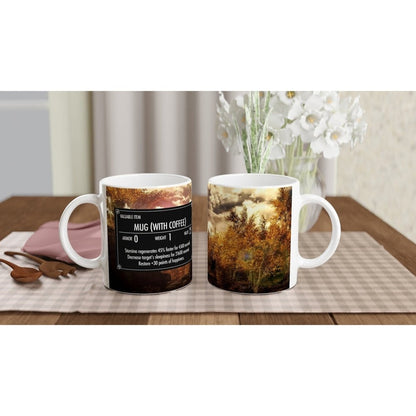 A white ceramic Skyrim coffee mug displays a graphic resembling an item card from the video game Elder Scrolls, alongside a scenic landscape image of autumn trees.