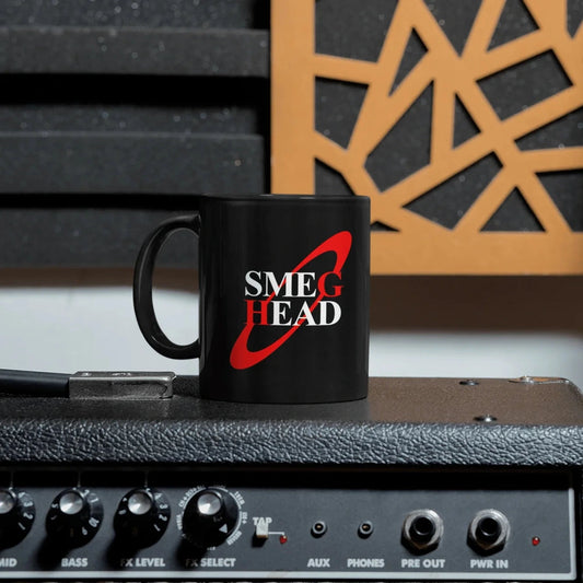 A black mug featuring the text Smeg Head in white font with a red circle behind it, inspired by Red Dwarf.