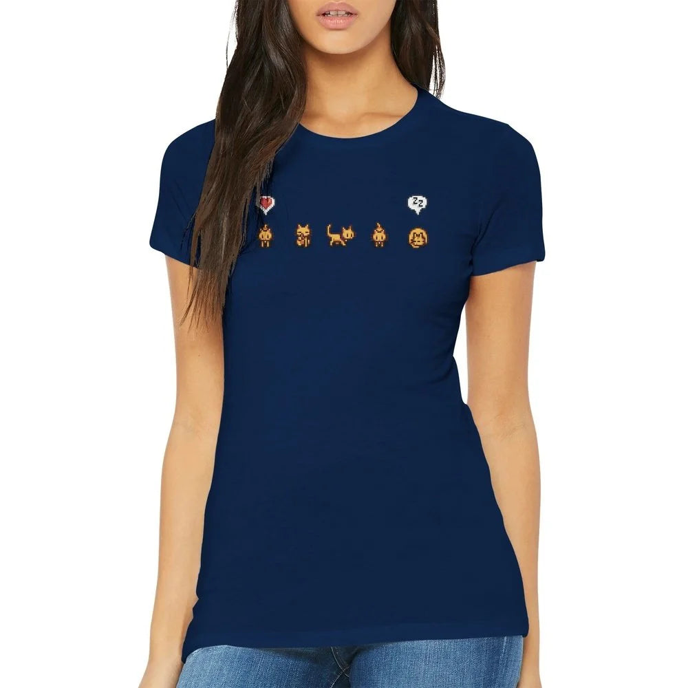 A woman wears a navy blue Stardew Valley T-Shirt featuring illustrations of ginger cats and emotes across the chest.