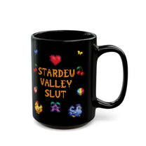 A black mug featuring pixel art graphics and the text Stardew Valley Slut in yellow font surrounded by small icons like hearts and fruit.