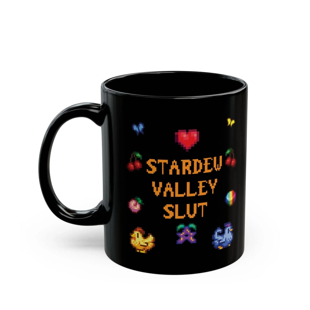 A black mug featuring pixel art graphics and the text Stardew Valley Slut surrounded by small icons like hearts, fruit, and butterflies.