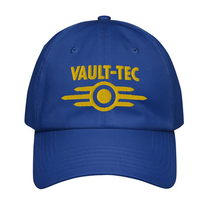 A blue Vault-Tec baseball cap features yellow embroidered lettering and a circular logo referencing the Fallout video game series.