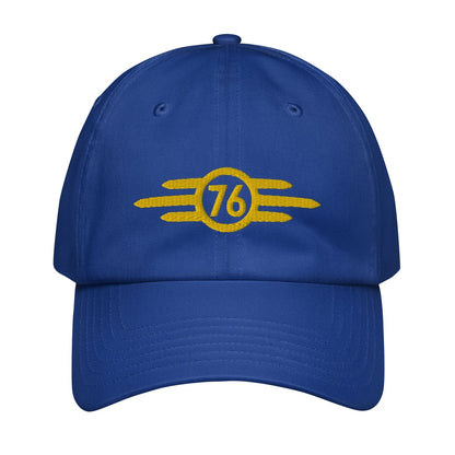 A blue Vault-Tec baseball cap features yellow embroidered lettering displaying the number 76, referencing the Fallout video game series.