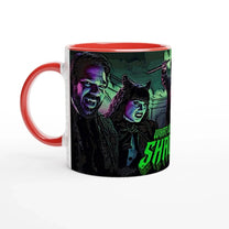 A red mug displays an illustration of Laszlo and Nadja from What We Do In The Shadows, along with a partial view of another figure and text on the side.