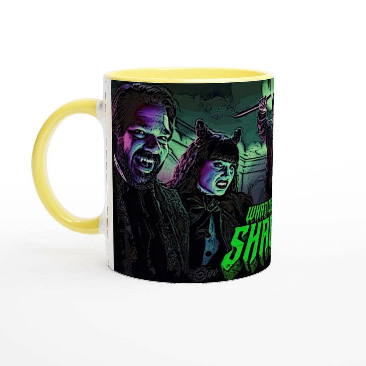 A ceramic mug displays a stylized illustration of Laszlo and Nadja from What We Do In The Shadows.
