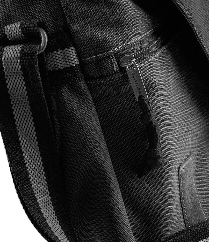 A close-up view of the textured canvas material and zipper detail on a Legend of Zelda Sheikah Eye messenger bag.